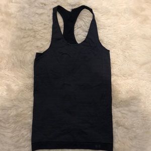 Under armour workout tank. Black and grey stripe Racer back Good condition. Sz M